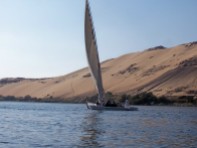 Aswan - felucca with sand hill